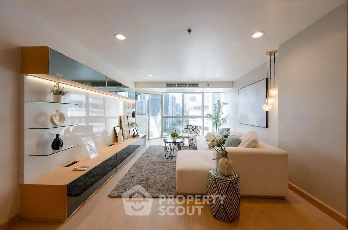 Spacious modern living room with elegant decor and city view