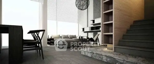 Modern living room with stylish furniture and elegant staircase