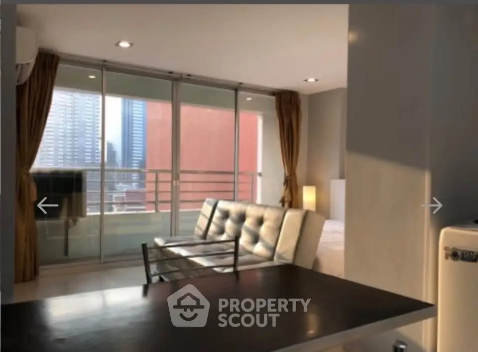 Modern living room with balcony view in urban apartment