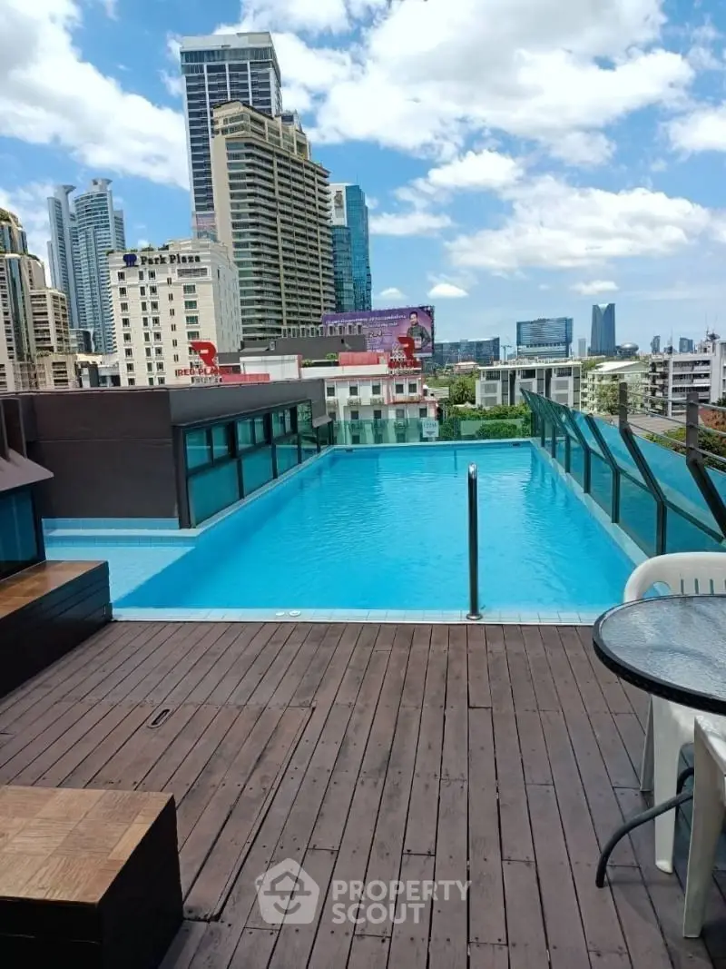 Stunning rooftop pool with city skyline view, perfect for urban living.