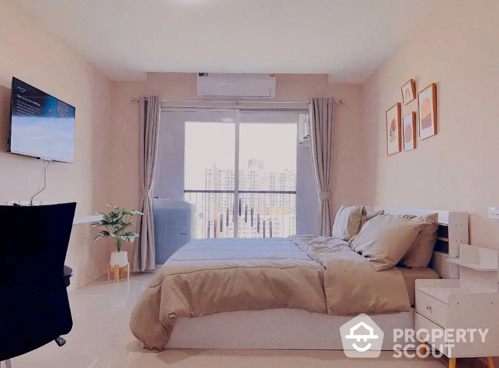 Modern bedroom with balcony view in high-rise apartment