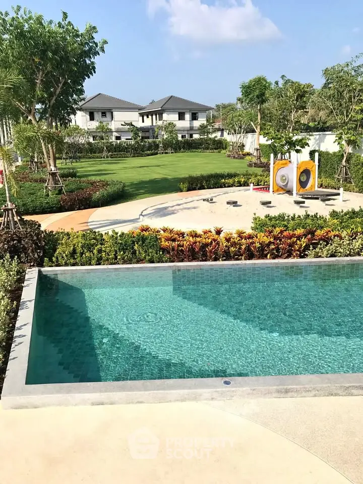 Luxurious residential garden with pristine pool and lush landscaping
