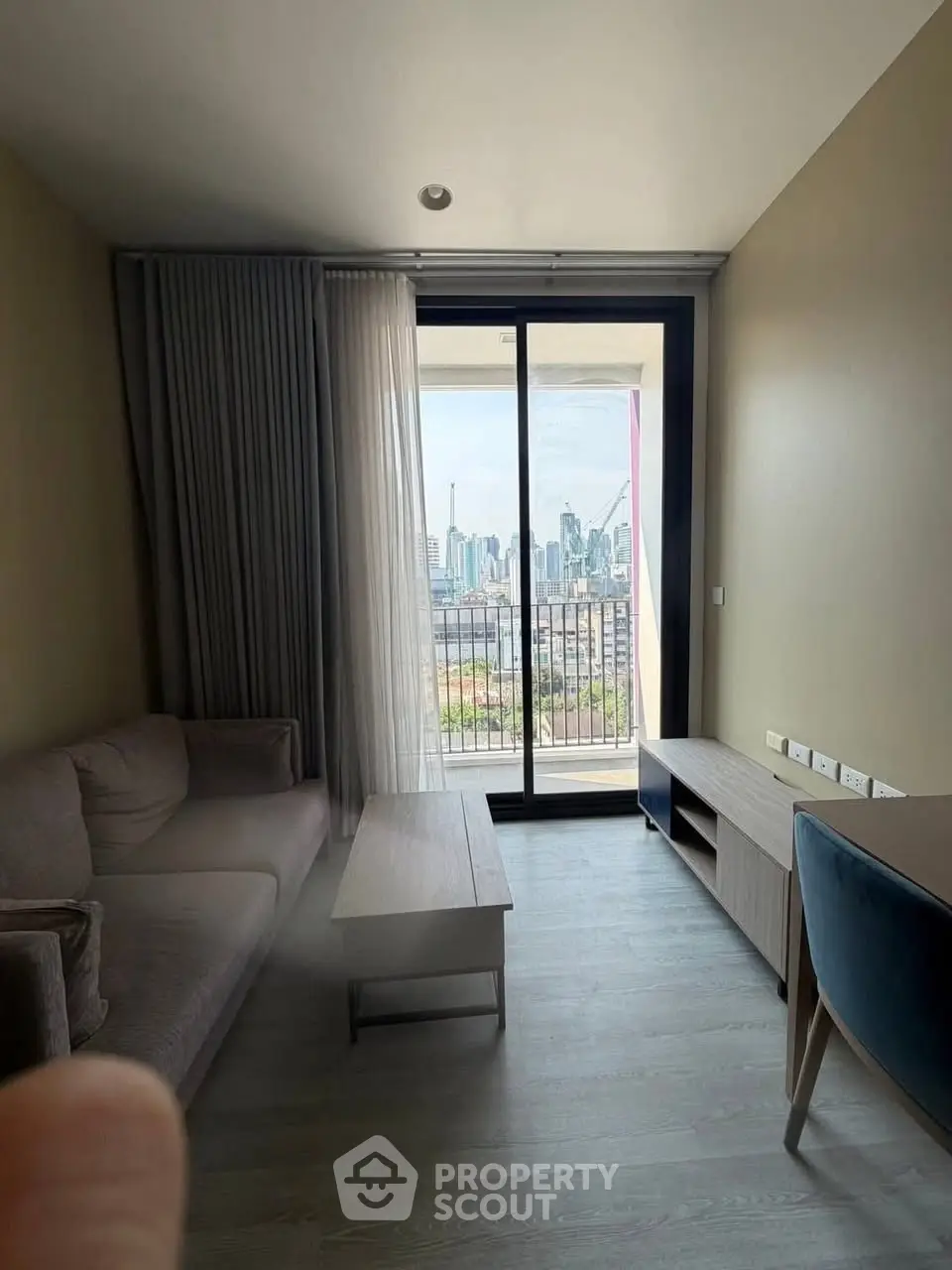 Modern living room with city view and stylish furniture