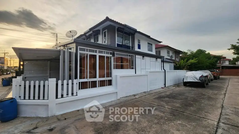 Charming two-story house with modern exterior and driveway parking