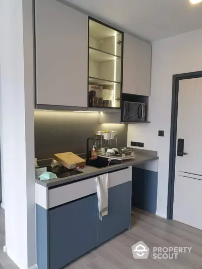 Modern kitchen with sleek cabinets and under-cabinet lighting