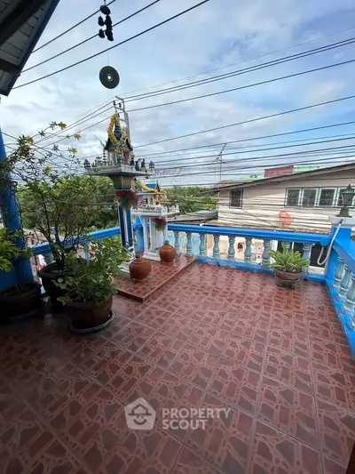 Charming balcony with traditional decor and scenic view, perfect for relaxation and enjoying the outdoors.