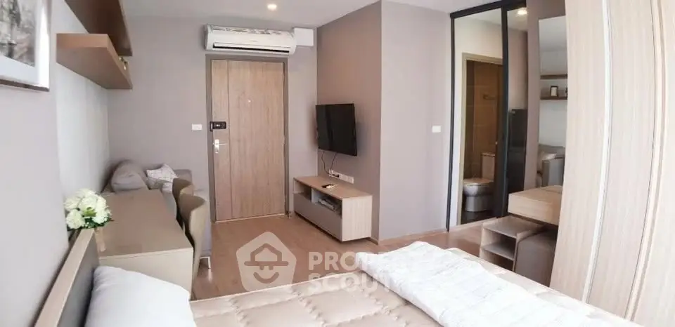 Modern studio apartment with cozy living area and stylish decor