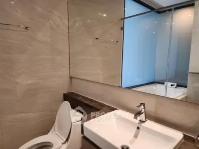 Modern bathroom with sleek design and large mirror