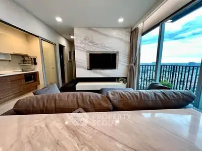 Modern living room with stunning city view and elegant marble accents