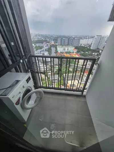 High-rise balcony with washing machine and stunning city view