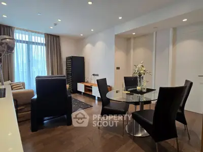 Modern living room with elegant dining area and large window view