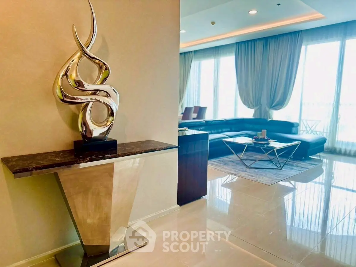 Luxurious living room with modern sculpture and elegant decor