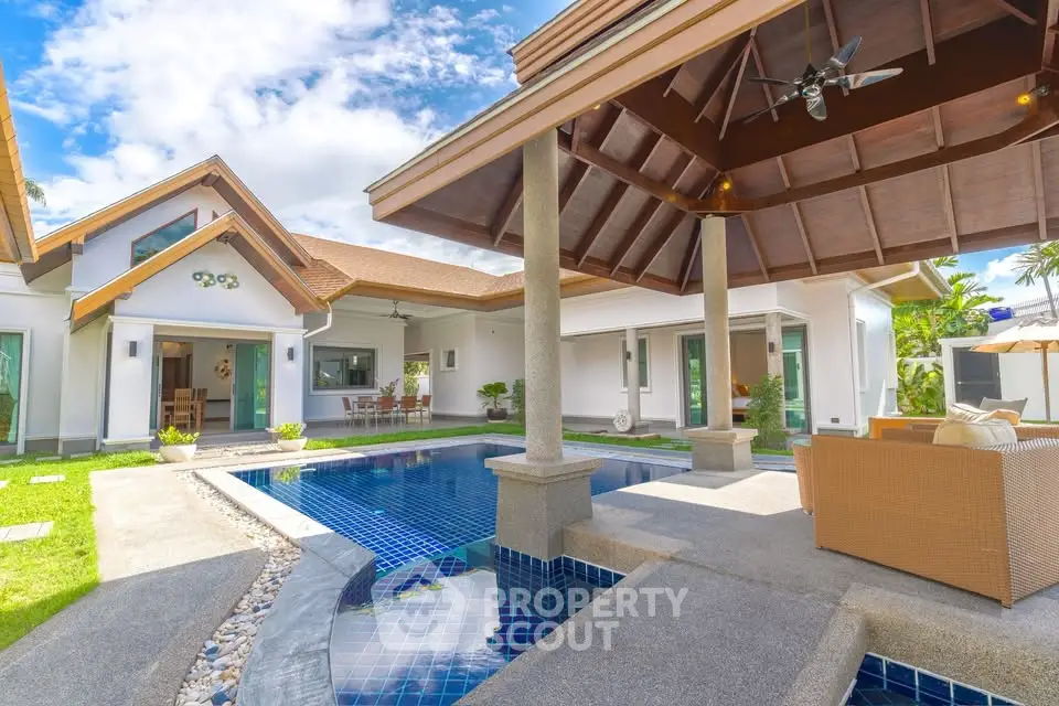 Luxurious villa with private pool and spacious outdoor seating area, perfect for relaxation and entertainment.