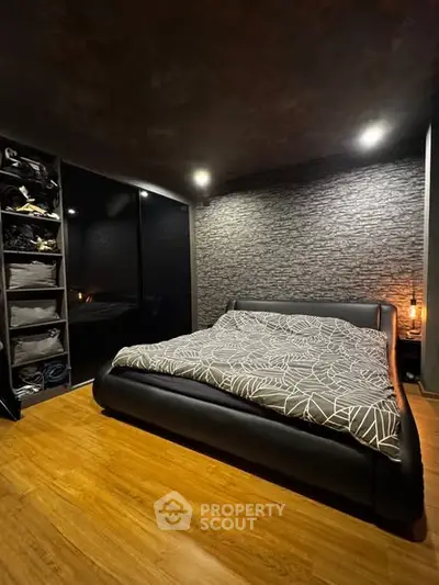 Luxurious modern bedroom with stylish black decor and cozy lighting