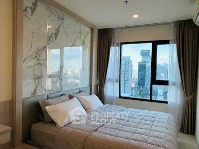 Luxurious bedroom with city view and elegant marble accent wall in modern apartment.