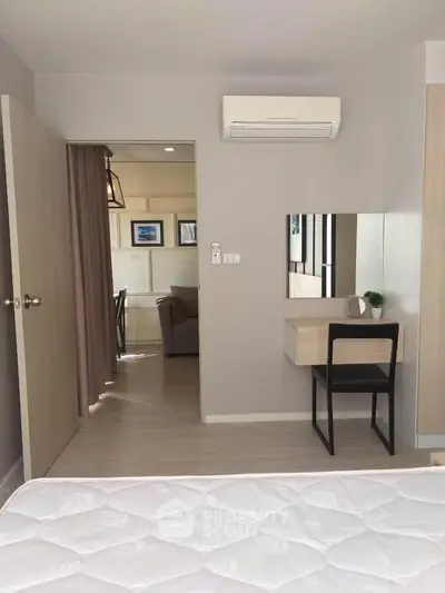 Modern bedroom with minimalist decor and air conditioning unit