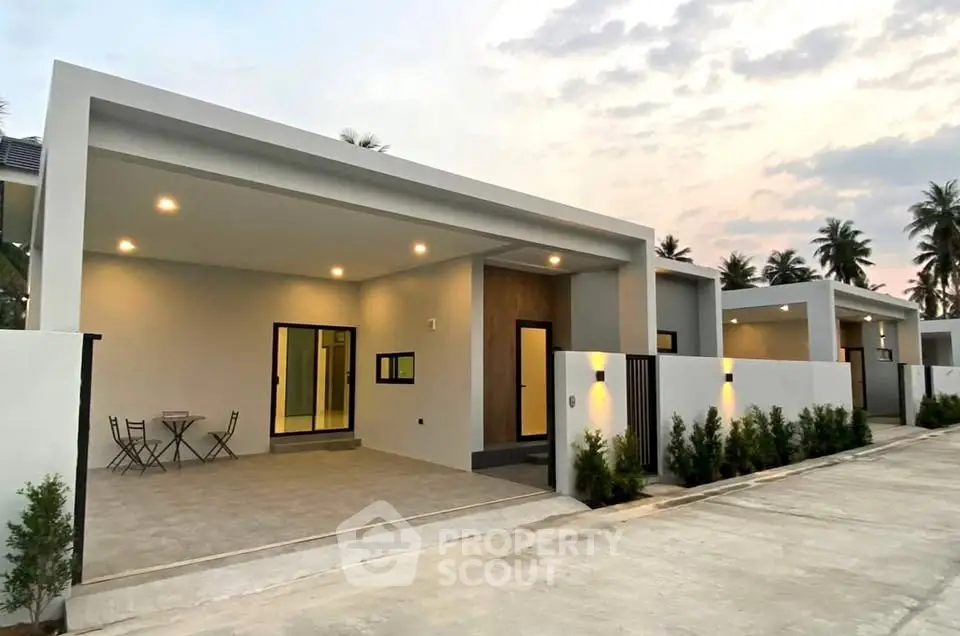 Modern single-story home with sleek design and spacious patio in serene neighborhood.