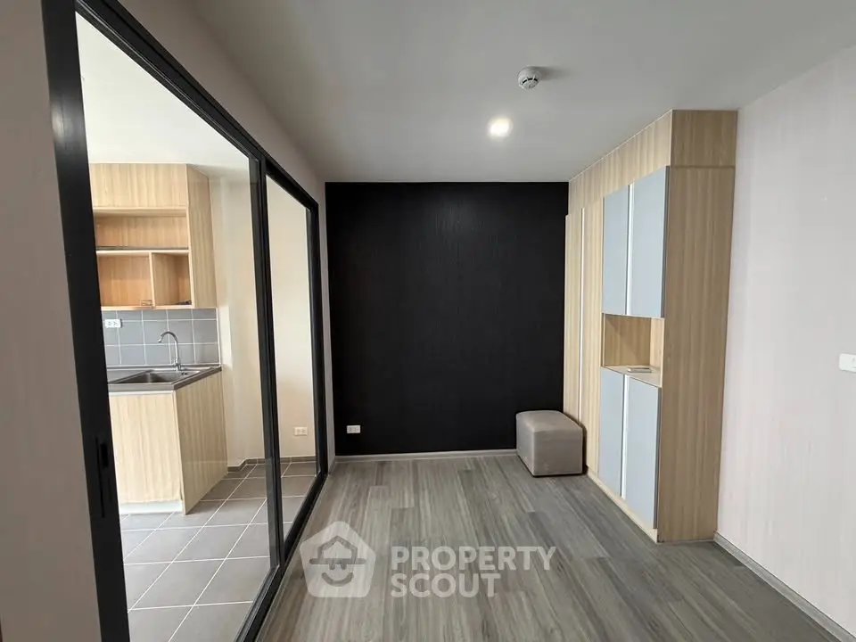 Modern apartment interior with sleek kitchen and stylish flooring