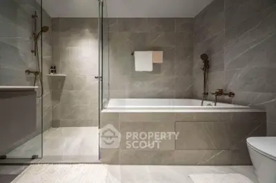 Luxurious modern bathroom with elegant bathtub and sleek design.