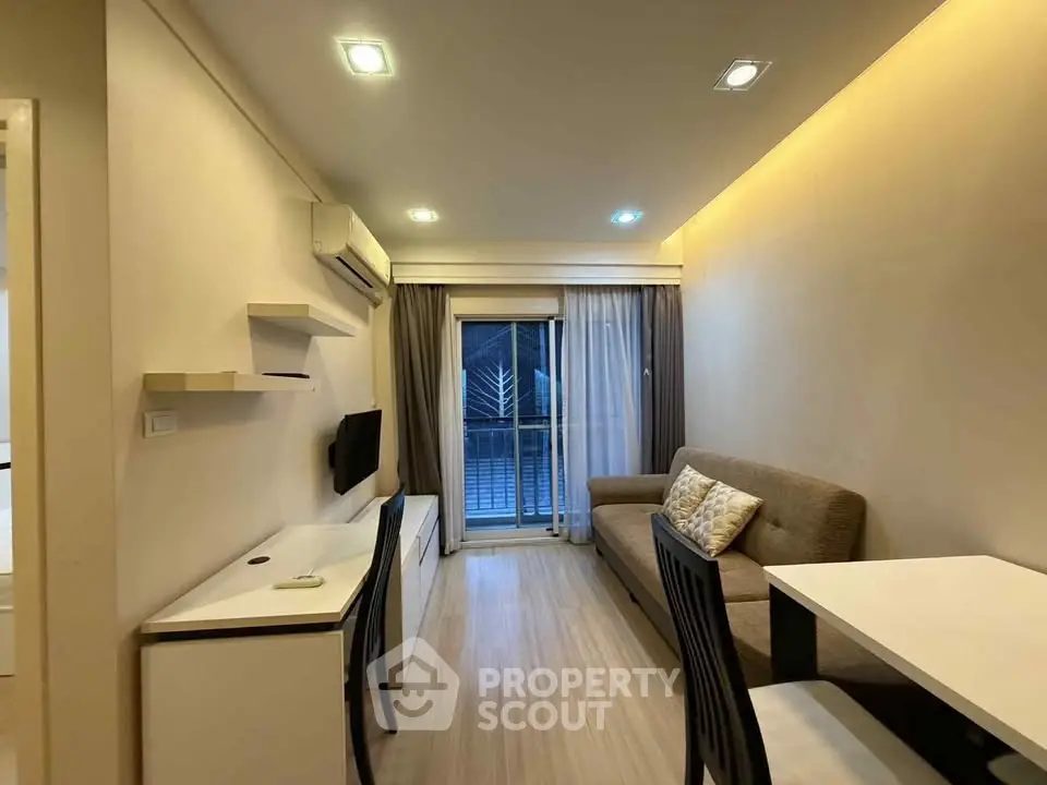 Modern living room with cozy sofa and balcony view