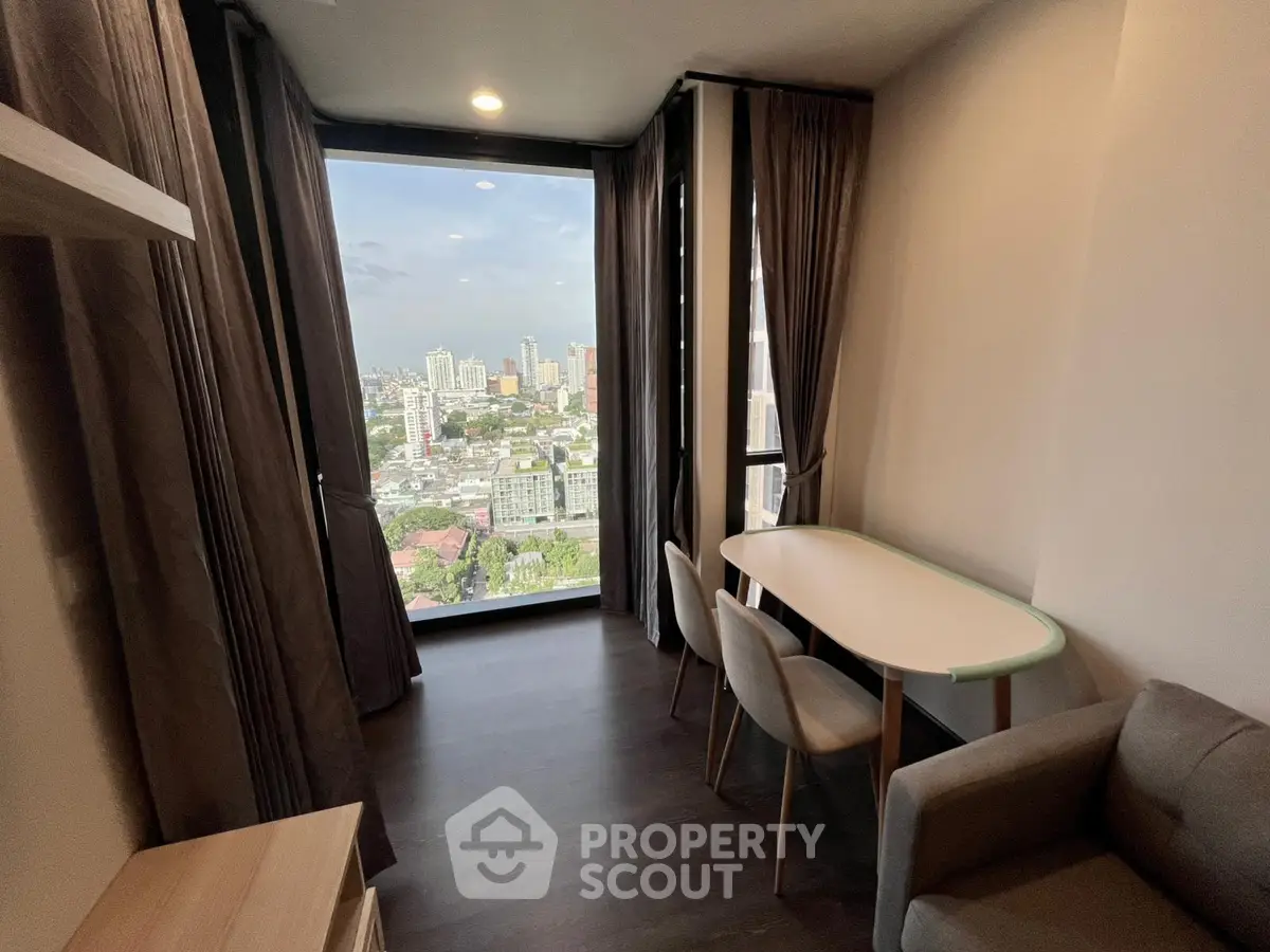 Modern living room with panoramic city view and elegant furnishings