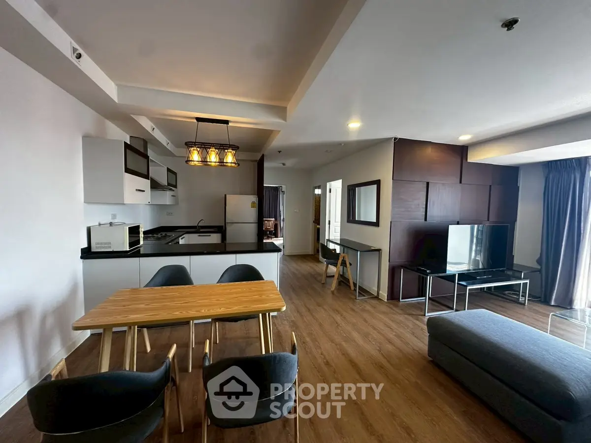 Spacious modern living room with open kitchen and stylish decor