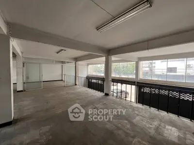 Spacious commercial space with large windows and open layout, ideal for office or retail use.