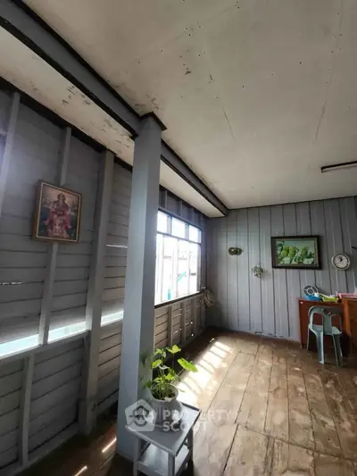 Charming rustic interior with wooden floors and vintage decor, perfect for cozy living.