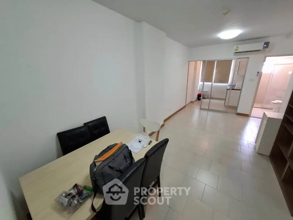 Spacious living room with dining area in modern apartment
