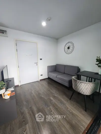 Modern living room with stylish decor and cozy seating area, perfect for relaxation and entertainment.