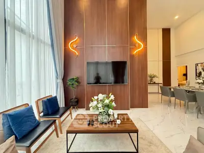 Luxurious modern living room with high ceilings and elegant decor