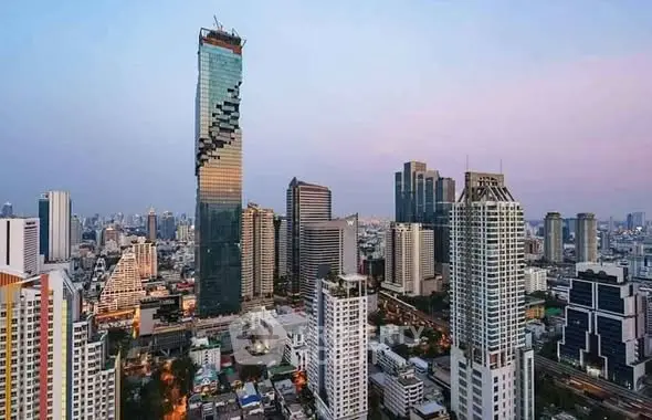 Stunning cityscape view featuring iconic skyscraper at sunset.