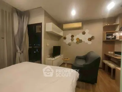 Modern studio apartment with cozy living area and stylish decor