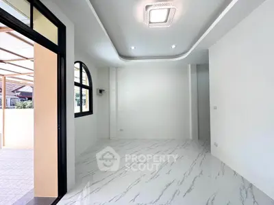 Spacious modern living room with elegant flooring and stylish ceiling lights