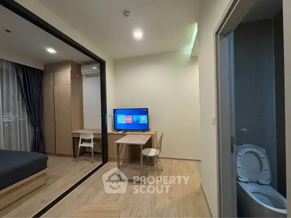 Modern studio apartment with open layout and sleek furnishings