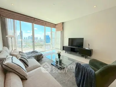 Spacious living room with panoramic city view and modern furnishings