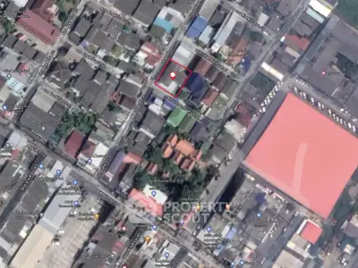 Aerial view of urban real estate area with marked property boundaries.