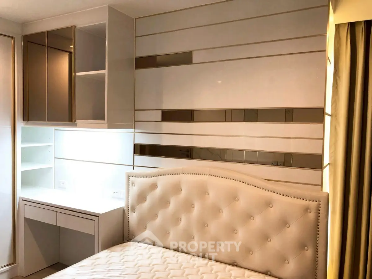 Luxurious bedroom with elegant headboard and built-in storage