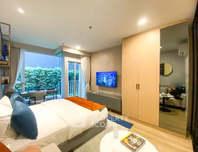 Modern bedroom with balcony and stylish decor in urban apartment