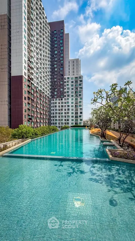 Luxurious high-rise apartment with stunning rooftop pool and city views.