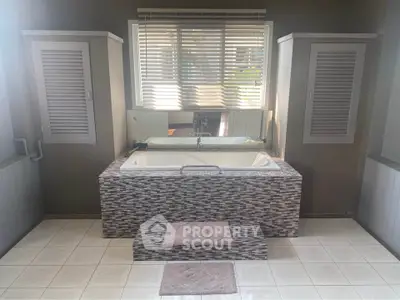 Luxurious bathroom with elegant bathtub and stylish tile design