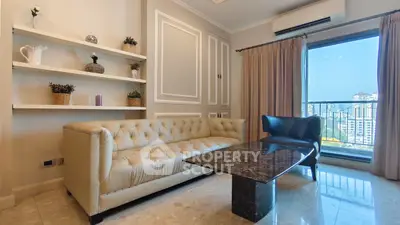 Luxurious living room with elegant sofa and stunning city view from large window.