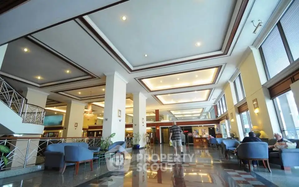 Spacious hotel lobby with elegant seating and modern lighting