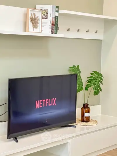 Modern living room with stylish decor and TV setup, perfect for relaxation and entertainment.