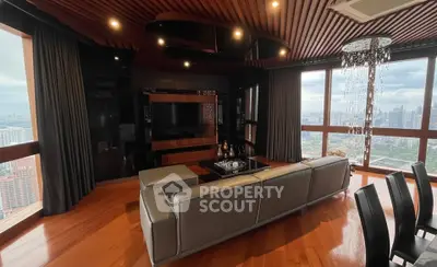 Luxurious high-rise living room with panoramic city views and elegant decor.