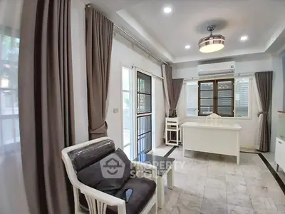 Spacious living room with modern decor and natural light