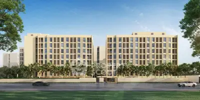 Modern apartment building with palm trees and clear blue sky, showcasing contemporary architecture.