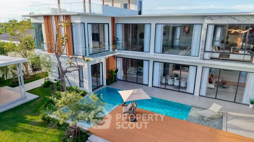 Luxurious modern villa with private pool and spacious outdoor deck, perfect for relaxation and entertainment.
