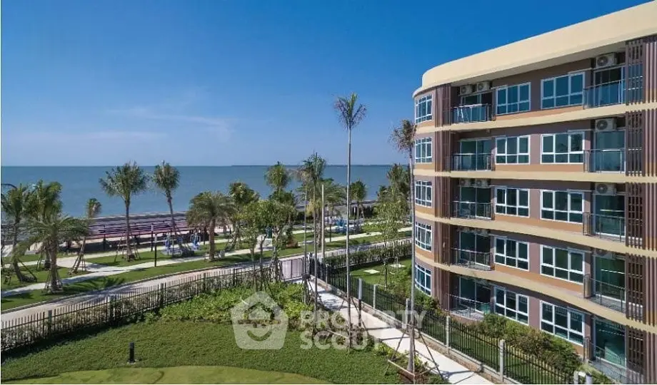 Stunning beachfront condominium with lush gardens and ocean views, perfect for luxury living.