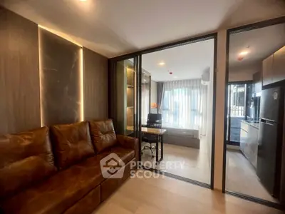 Modern apartment with open layout, featuring a cozy living area and stylish study nook.